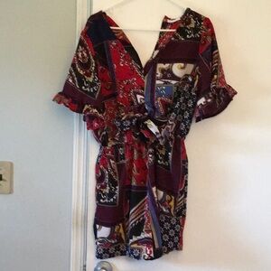 adorable, New York and Company romper. Front cut out with ties